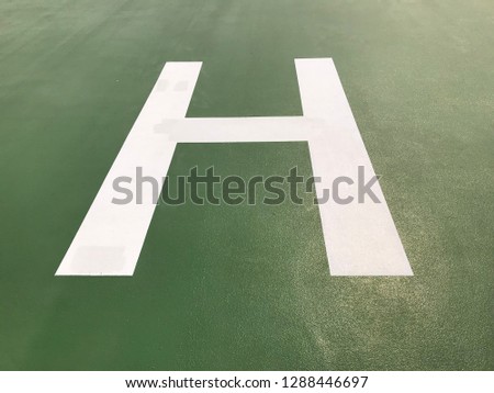 H alphabet character on the roof top to sign this is helipad for helicopter landing