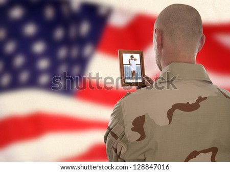 Conscript  marine looks at the photo of the girlfriend
