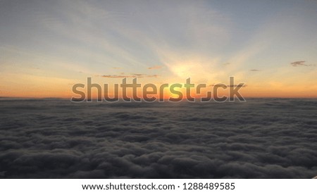 Beautiful sunset from the sky with the clouds in your hands