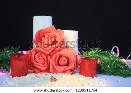 Photoshoot of flower, candle burning and lamp for decoration Valentine's