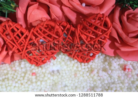 Photoshoot of roses on background sand. Valentine's day