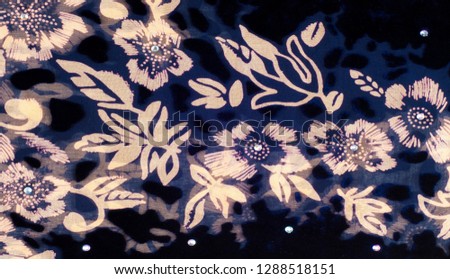 texture silk cloth. dark blue with gold-painted flowers