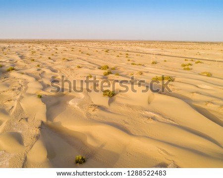 Big sand dunes panorama. Desert or beach sand textured background.Tarim Desert, Xinjiang