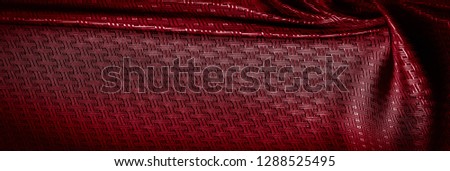 Background texture, pattern. Red silk fabric with a small checkered pattern. A classic look, add this to your designer collection. If you are looking for a red runway, you can learn how to go.