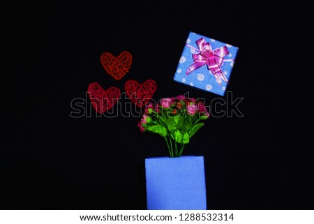 Photoshoot of gift boxes, flower and decorative heart. Valentine day