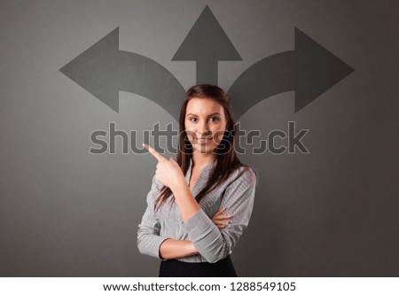 Business person choosing between two directions