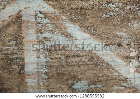 old gray wooden board with cracks and peeling blue white paint. natural rough surface texture