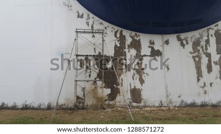 White wall and blue color with scaffolding wall background with free space  : repainting color background and renovation concep