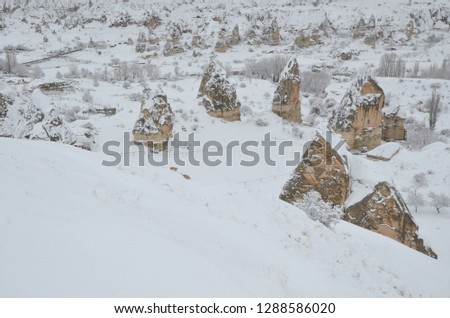Breathtaking view of Valley in winter season, Cappadocia national park, Turkey. Heavy snow fall during christmas time.