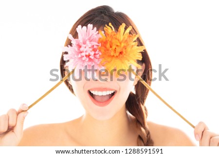 closeup young smiling beauty face with flower