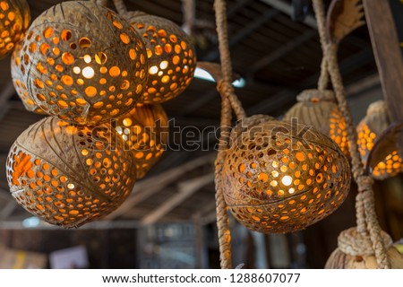 Traditional Lamp made of coconut shell on Sale In Market, Thailand