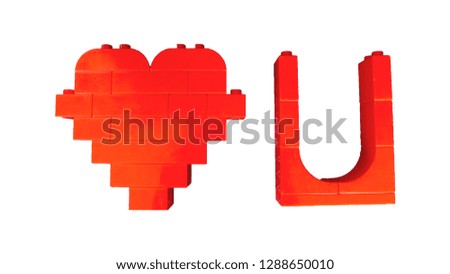 i love you  from red toy plastic blocks on white background. valentine's day concept