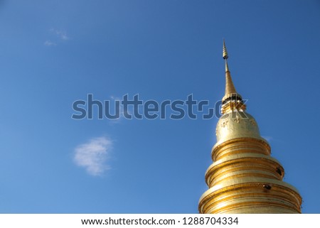 Ancient temple and golden pagoda with beautiful sky