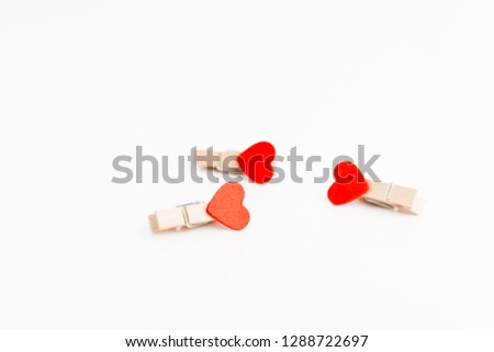 Three cloth pin with heart. Space for text. Valentine's Day.