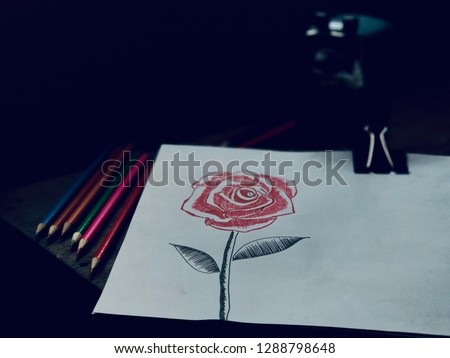 Still life image of Beautiful Rose bouquet flower,hand drawing on white paper,crayon and sharpener on old wood,in dark tone,dimly light.Rural style or vintage tone.Broken heart,valentine's day concept