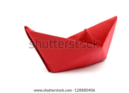 Origami red paper ship on white background.