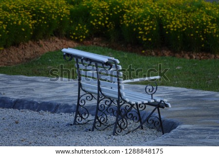 lonely empty bench in public park for rest