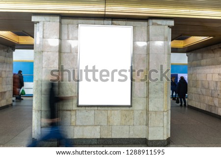 vertical poster. outdoor advertising in the evening. In the underground