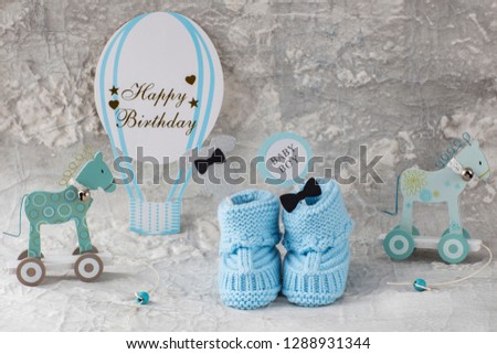 booties, two toy horses, balloon, festive decor - boy's birthday card
