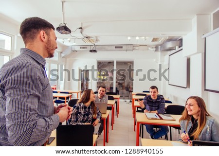 Young students are in classroom, they are listening carefully