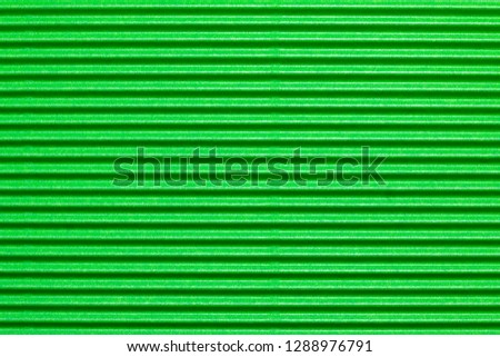 Abstract background of close up detail of green corrugated cardboard