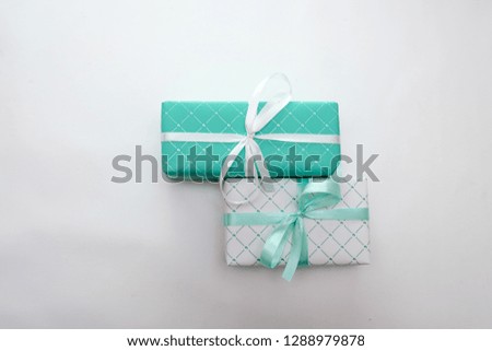 Green and white gift boxes with ribbons isolated on white background, holidays