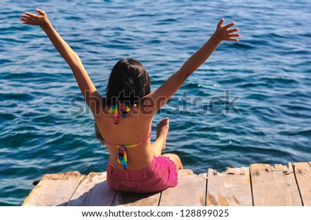 tanning young woman enjoying the sea