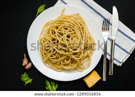 Spaghetti with spicy oil, cheese, knife and fork stock photo