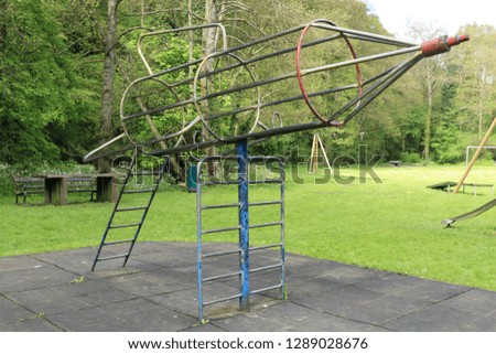 Rocket shaped climbing frame from an English park. Rocket shaped metal climbing frame from an English park.