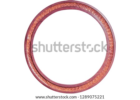 Vintage round wooden frame from purple wood with leather decoration isolated on white background with clipping path.