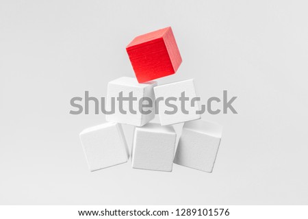 Business & design concept - Abstract geometric real floating wooden pyramid isolated on background, it's not 3D render. symbol of leadership, teamwork and success
