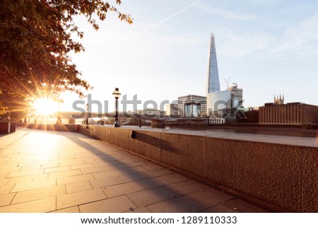 River bank and London skyline  with the Shard at sunrise