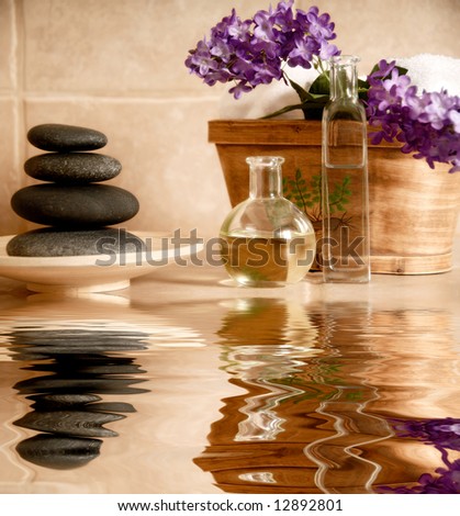 day spa products with stones, oil container, flowers Royalty-Free Stock Photo #12892801