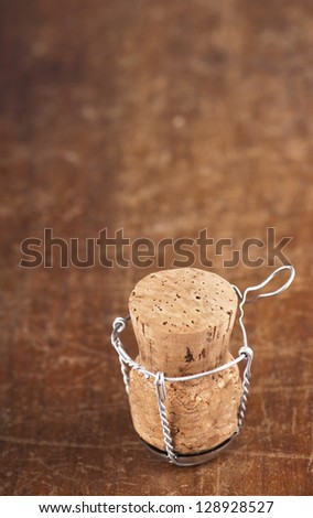 Cork-stopper of champagne/  Wooden Background