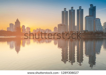 City building with water reflection, cityscape background