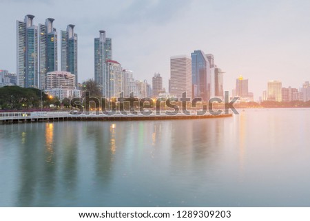 City public water lake over office building, cityscape background