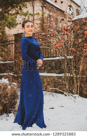 Arabic woman in long fashionable dress, womens fashion, cold season