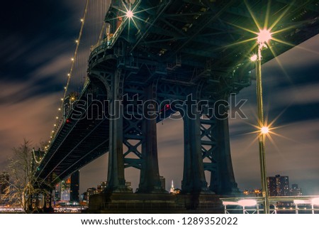 View of the Manhattan Bridge and Manhattan from the riverside of the East River at night  - 3