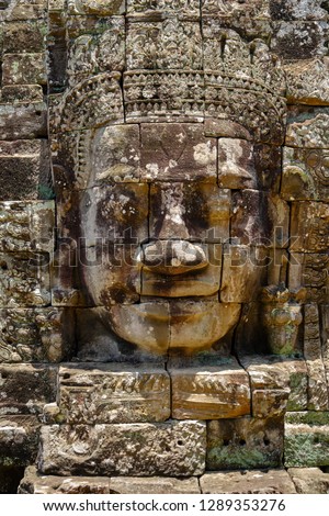 One of the faces at Bayon Temple, Angkor thom, Cambodia. Royalty-Free Stock Photo #1289353276
