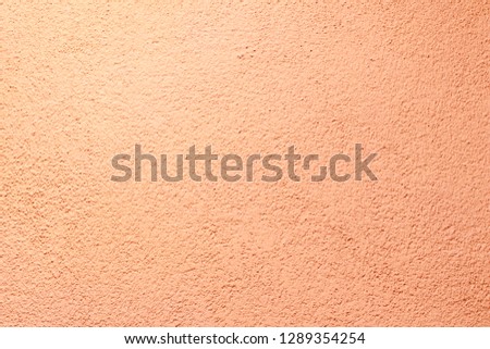 walls. plaster applied to it. composition of small stones. and in a special way pounded. frame location. light peach color