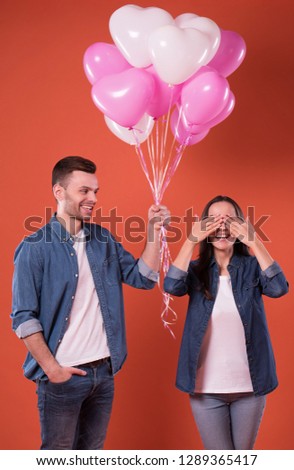 Couple in love with colorful balloons