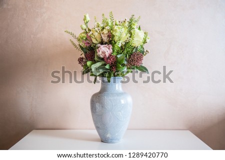 Bunch of elegant flowers in vase as love or Valentines day attribute image