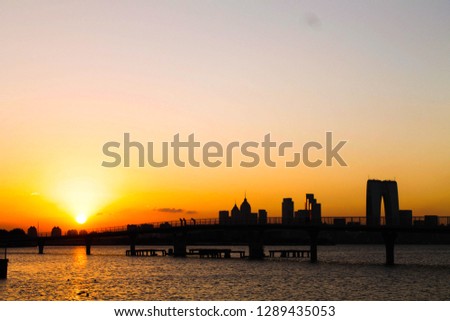 A picture of the sun setting over Suzhou on a summers evening.