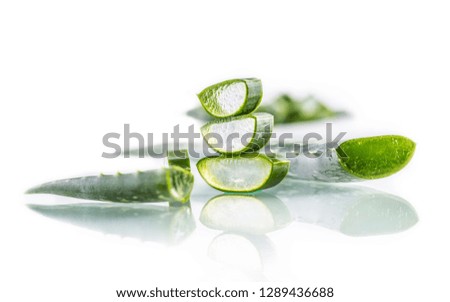 Slices of aloe vera with gel on white background.