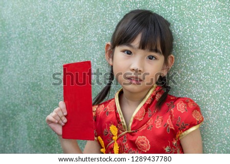 Portrait little girl Asian Red envelope Chinese New Year On Hand