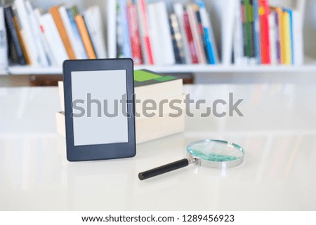 Internet and electronic books concept with e-book reader