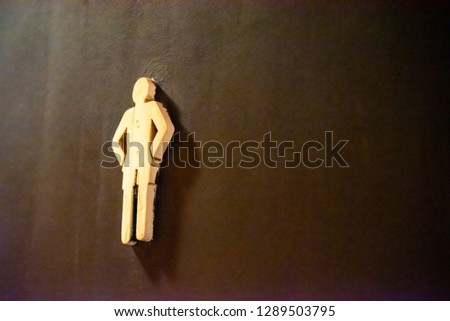 A man toilet sign on the door