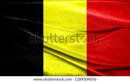 Realistic flag of Belgium on the wavy surface of fabric. Perfect for background or texture purposes