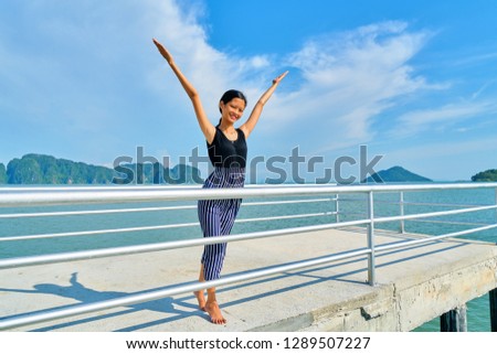 Beautiful woman posing - welcome sign, enjoying and smiling young woman
