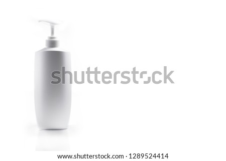 White Plastic bottle of shampoo isolated on white background.